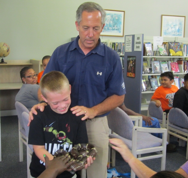 Mr. Hein and Jackson showing off a rat snake to the audience 640x606