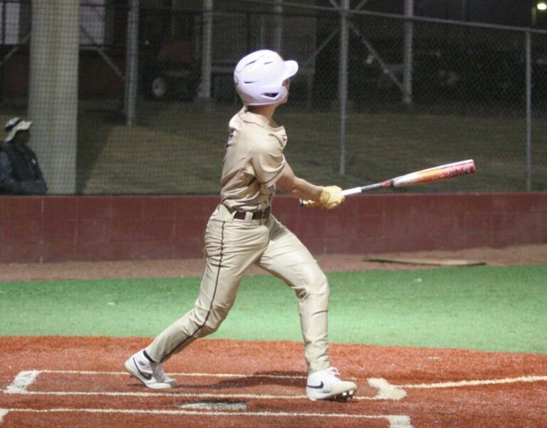 Payton Bryant watches his first home run of the season, which came at home against Richmond Hill earlier this season. Yesterday, Bryant hit his second home run in Coffee's 17-0 defeat of Bacon County. Bryant also threw a one-hit complete game and drove in four on the day.
