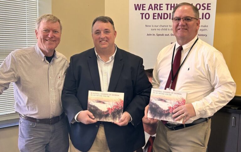 Douglas Rotary Club donates books to Coffee High School, Freshman Academy, CMS