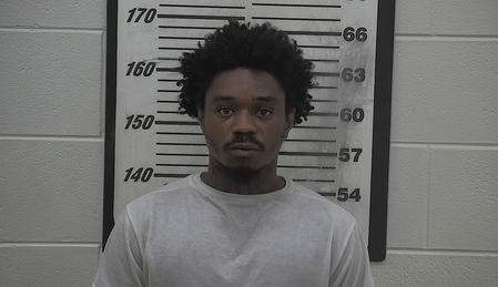 26-year-old allegedly leaves car wedged under dump truck overnight, leaves the scene