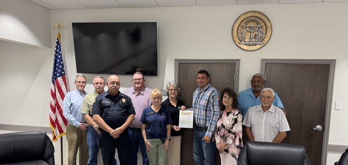 County commission awards resurfacing projects, signs childhood cancer awareness month proclamation
